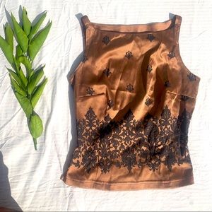 Copper tone shirt with floral designs